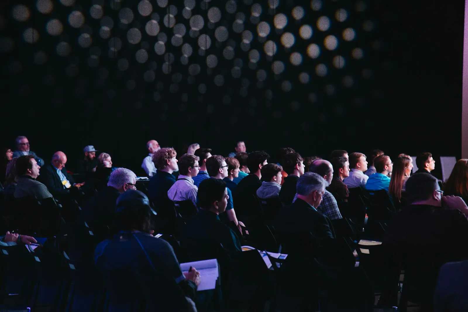 Audience in a dark auditorium